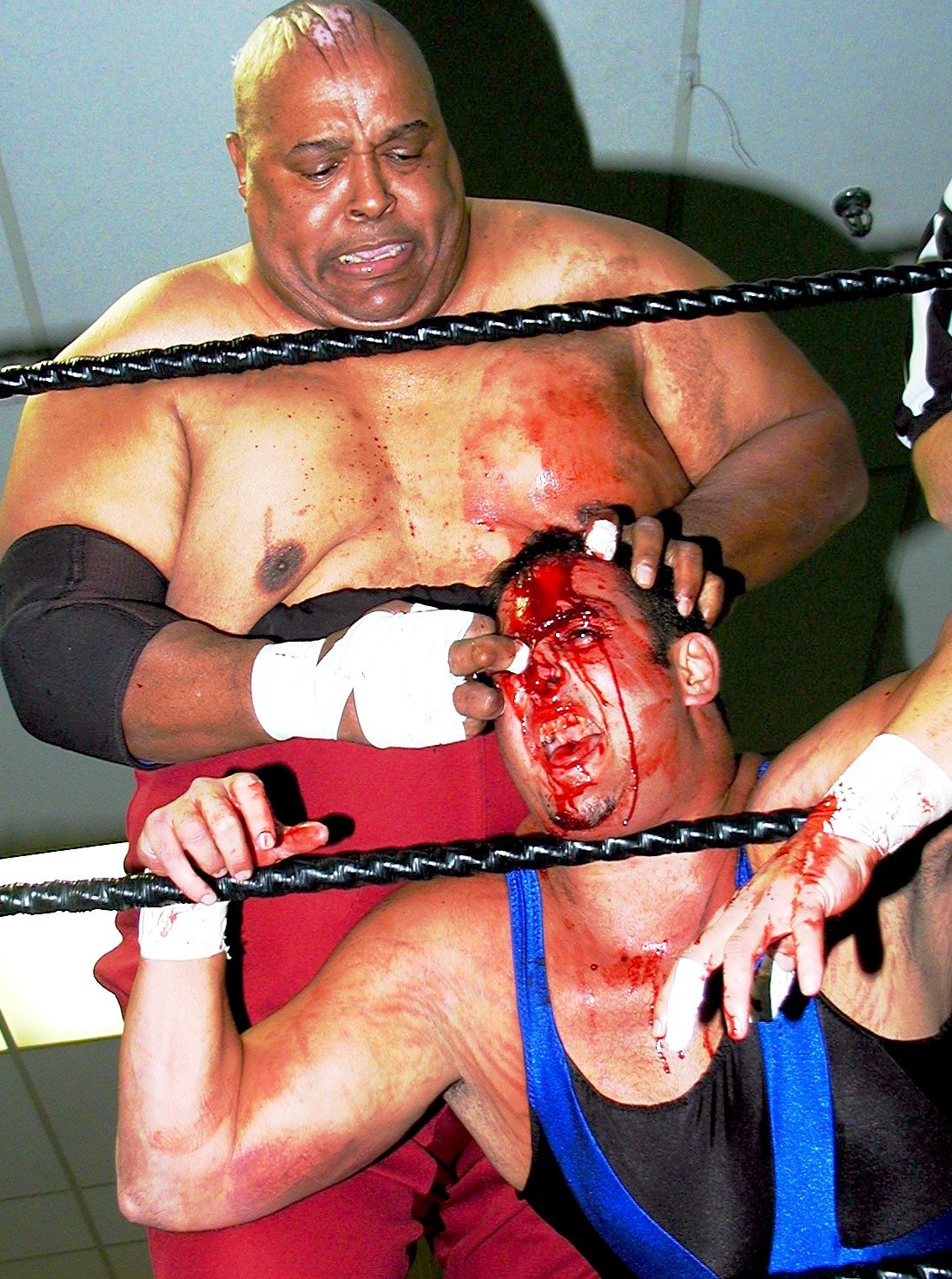 Abdullah the Butcher in a match against Andy Ellison in Côte St. Luc, Quebec, in 2004. I took the photo.