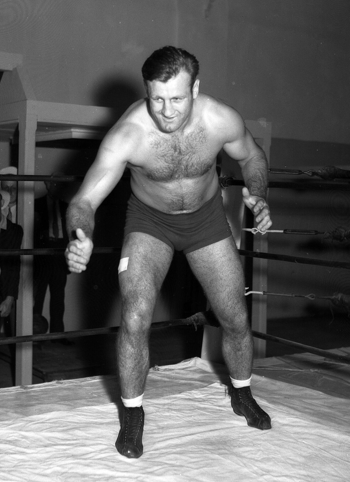 Wrestler and football player Bronko Nagurski posing in ring