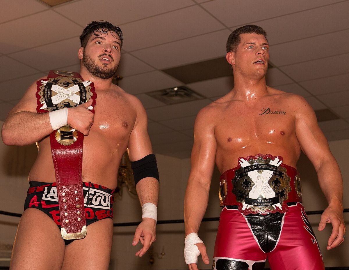 Ethan Page and Cody Rhodes with the Alpha-1 Tag Team championship belts in June 2017