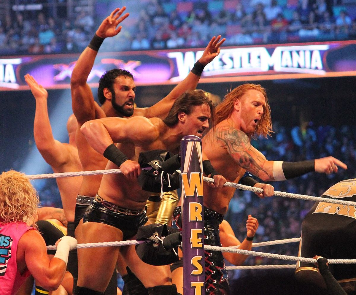 3MB (Jinder Mahal at centre left, Drew McIntyre at centre, Heath Slater at centre right) at WrestleMania XXX on 6 April 2014 in the Mercedes