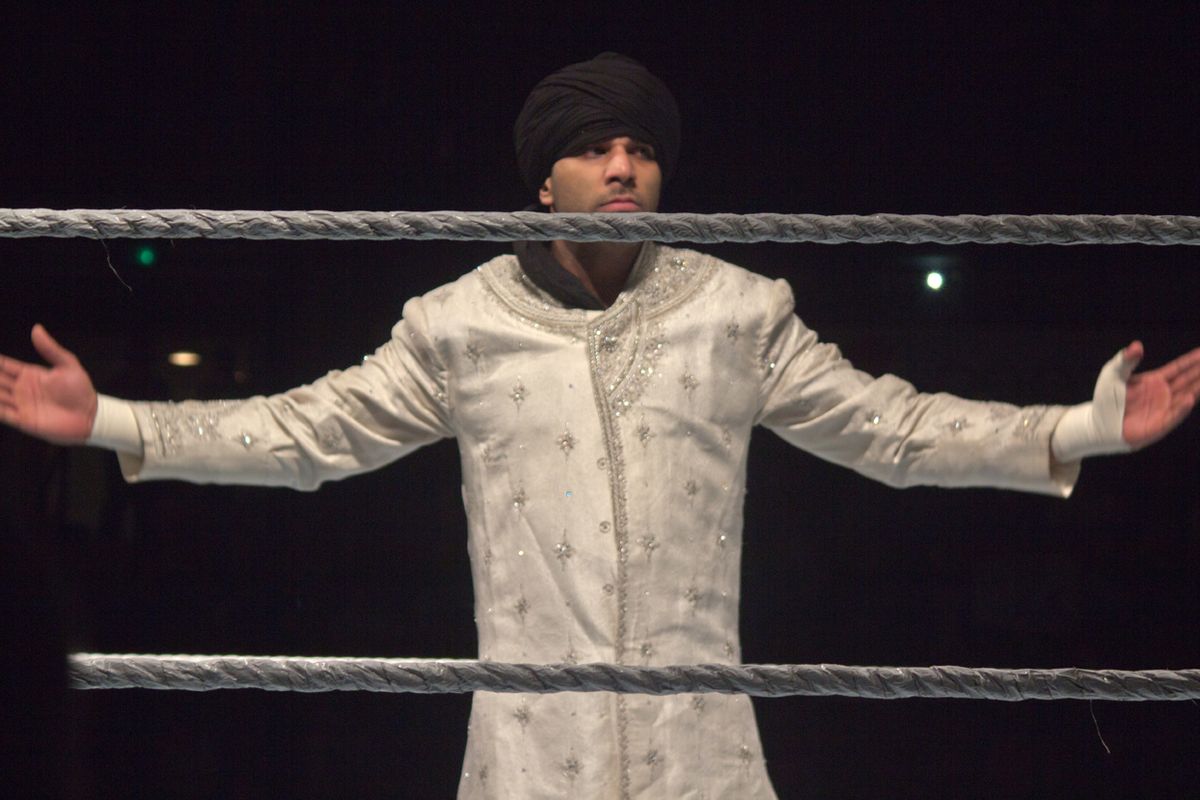 Jinder Mahal in his pre-match attire of a turban and a white robe. Photo taken at a WWE SmackDown live event in Montgomery, Alabama on Janua