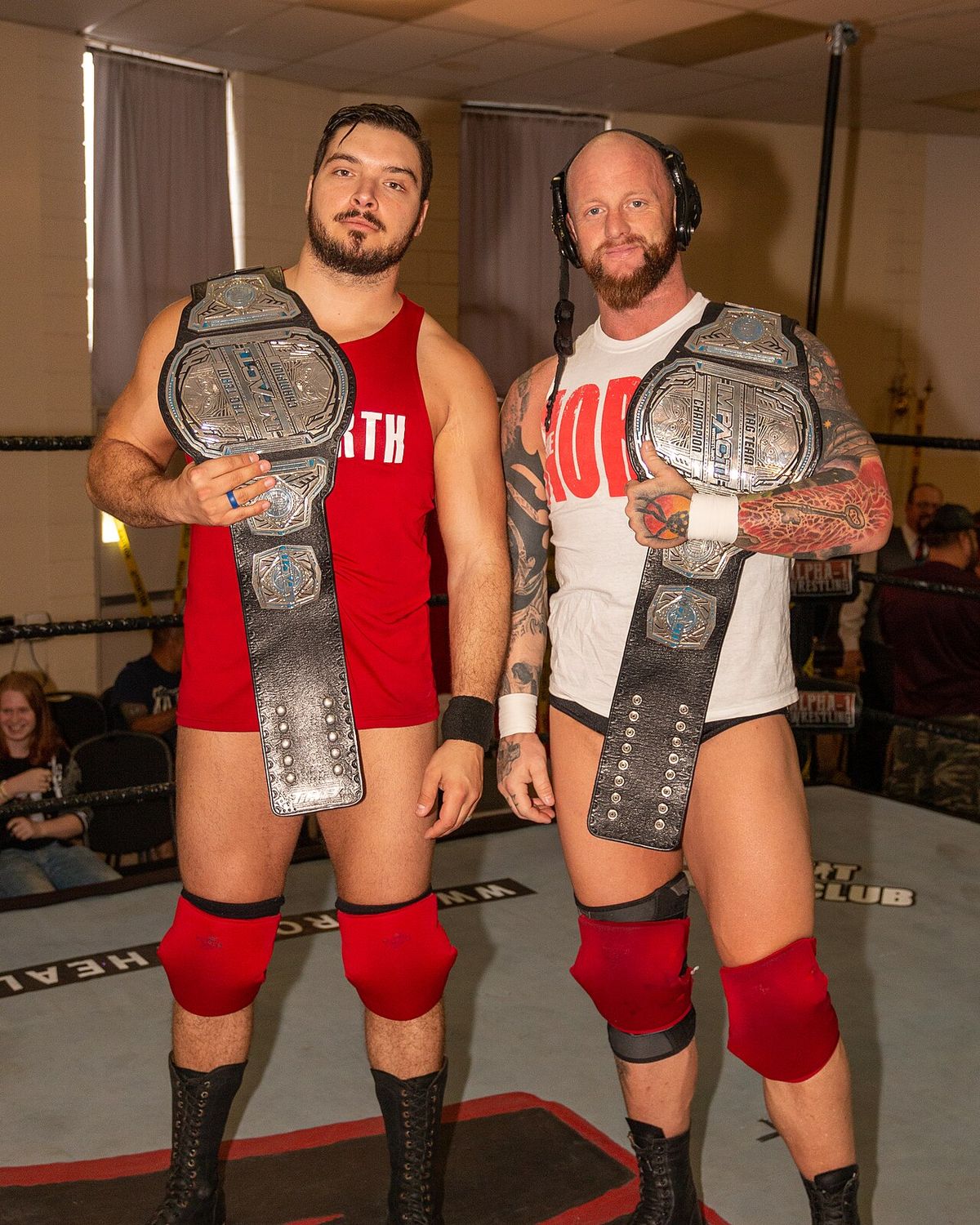 Impact World Tag Team champions The North - Ethan Page (left) and Josh Alexander - posing with the championship belts pre-show at an Alpha-1
