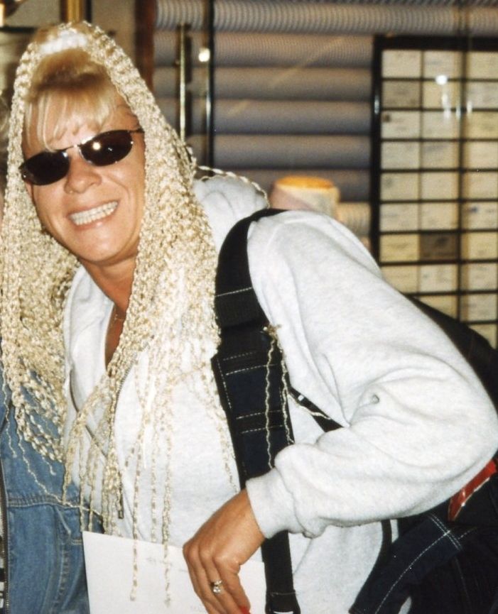 Professional wrestler Luna Vachon posing with a fan (cropped)