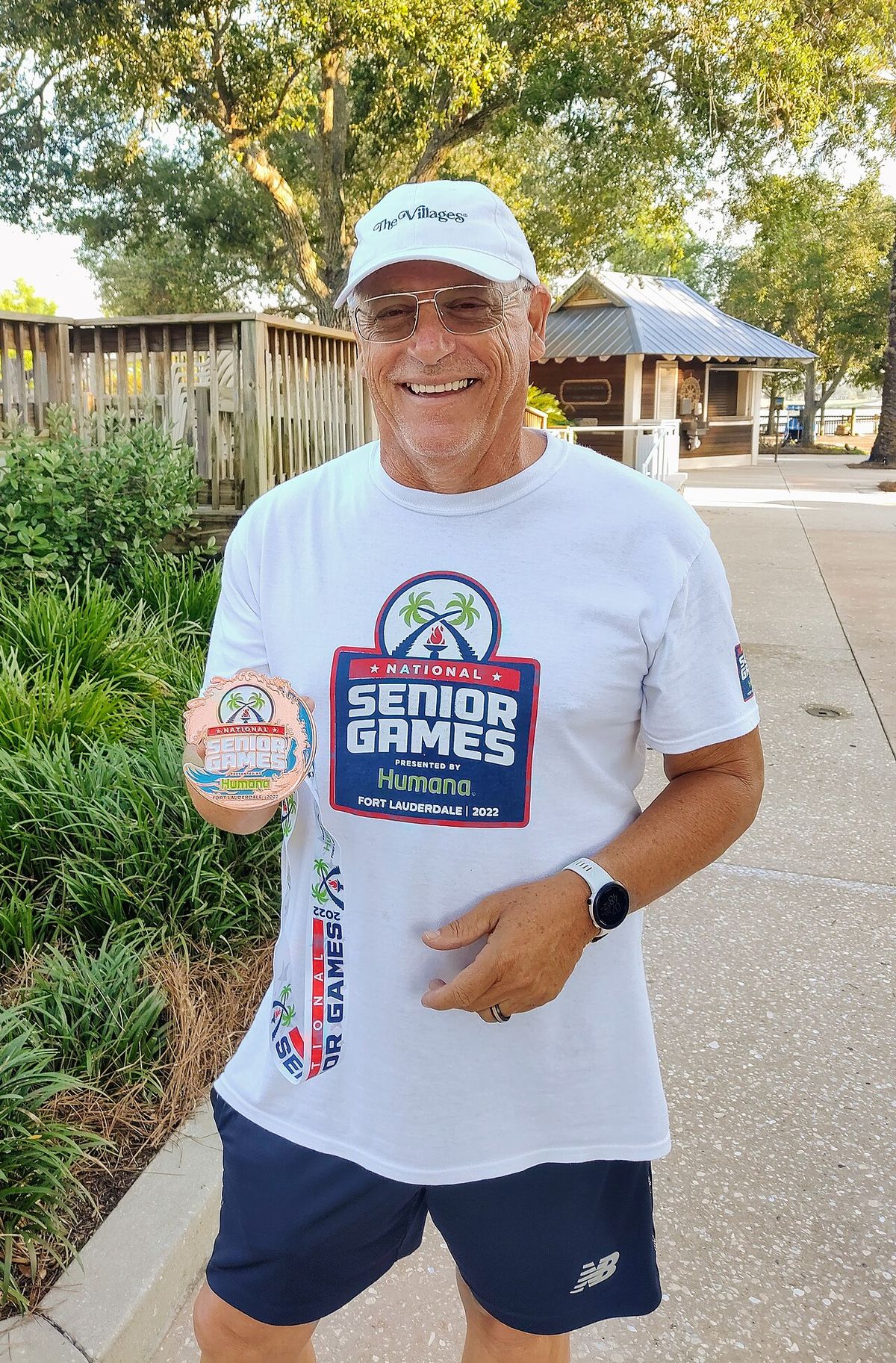 Man with a bronze medal in swimming from the 2022 Senior Games.