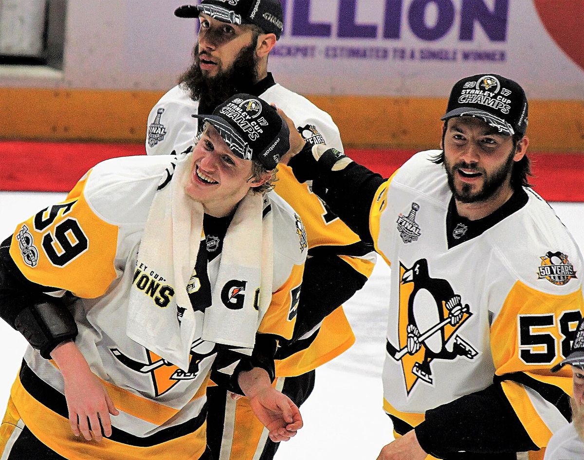 Pittsburgh Penguins forward Jake Guentzel and defenseman Krist Letang celebrate following the Penguins Stanley Cup clinching win in game 6 o