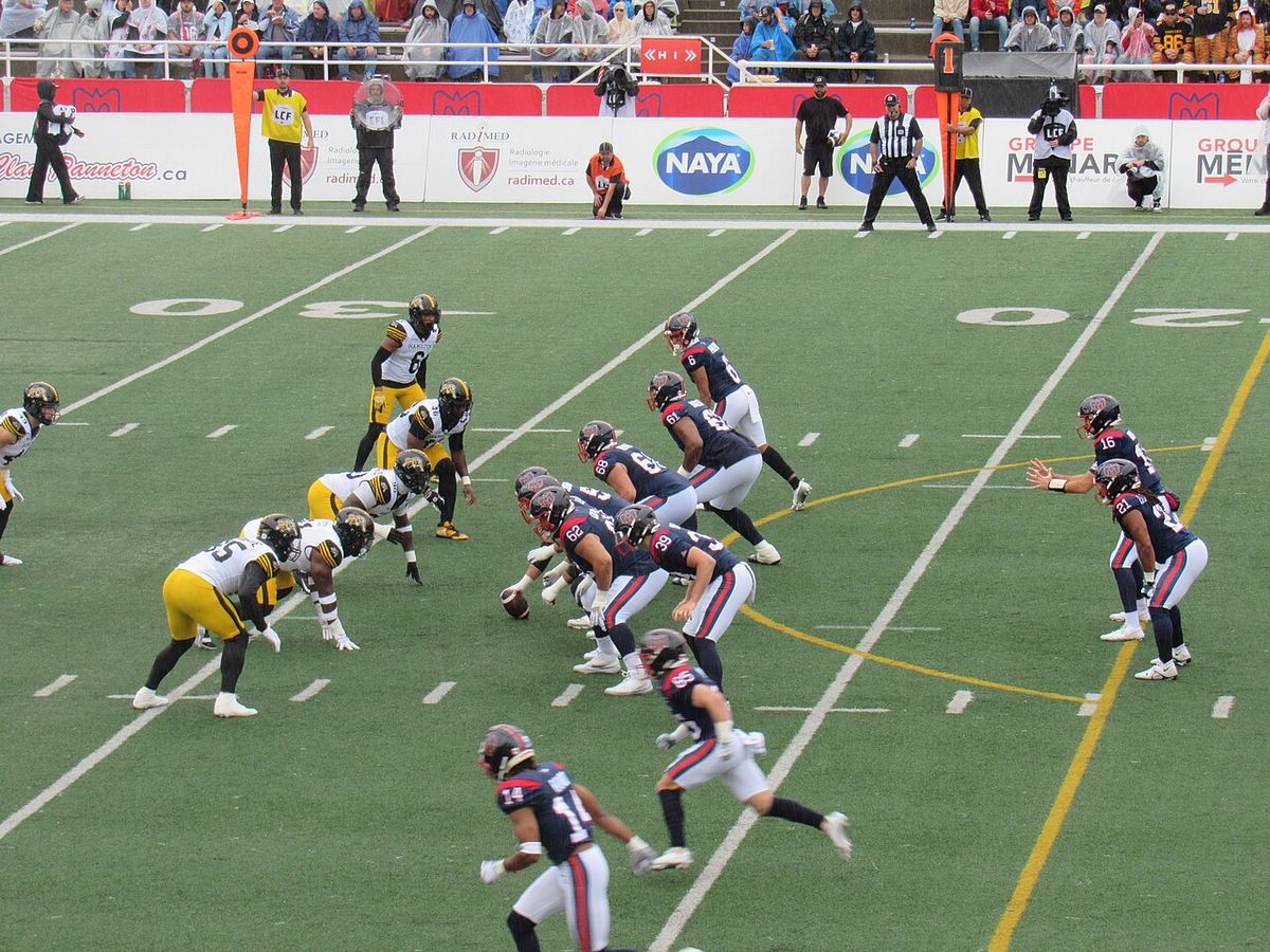 The Montreal Alouettes offense lines up facing the Hamilton Tiger-Cats defense in a game on September 6, 2025.