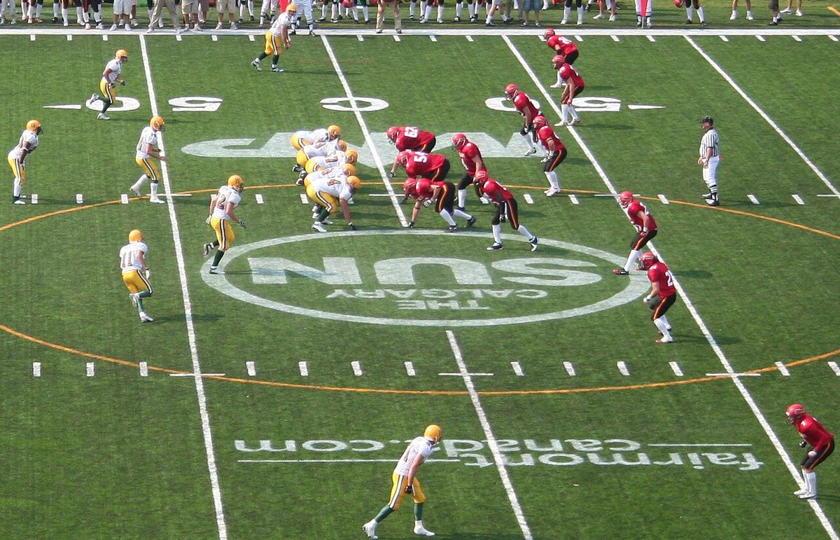A Canadian football game: University of Alberta Golden Bears at University of Calgary Dinos, McMahon Stadium, Calgary, September 9, 2006.