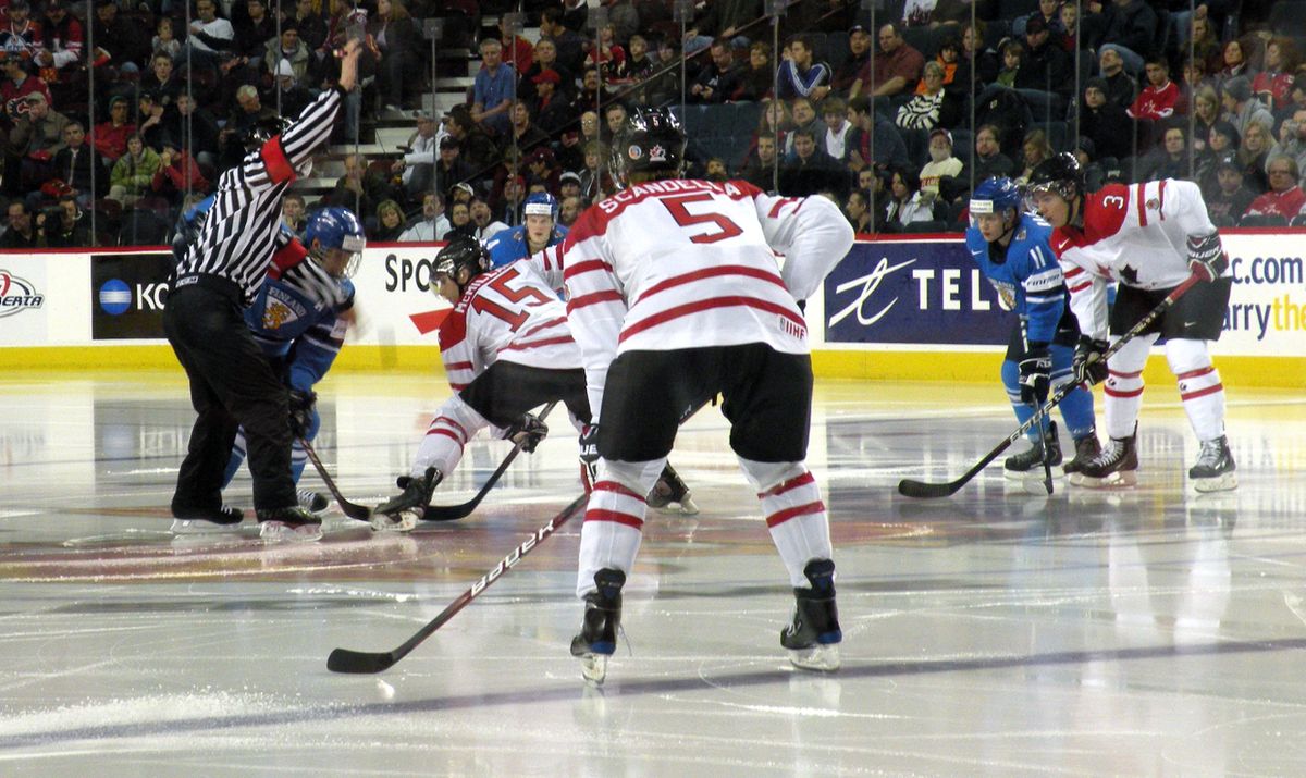 The Canadian and Finnish junior teams face off during a junior ice hockey exhibition game in Calgary, Alberta.