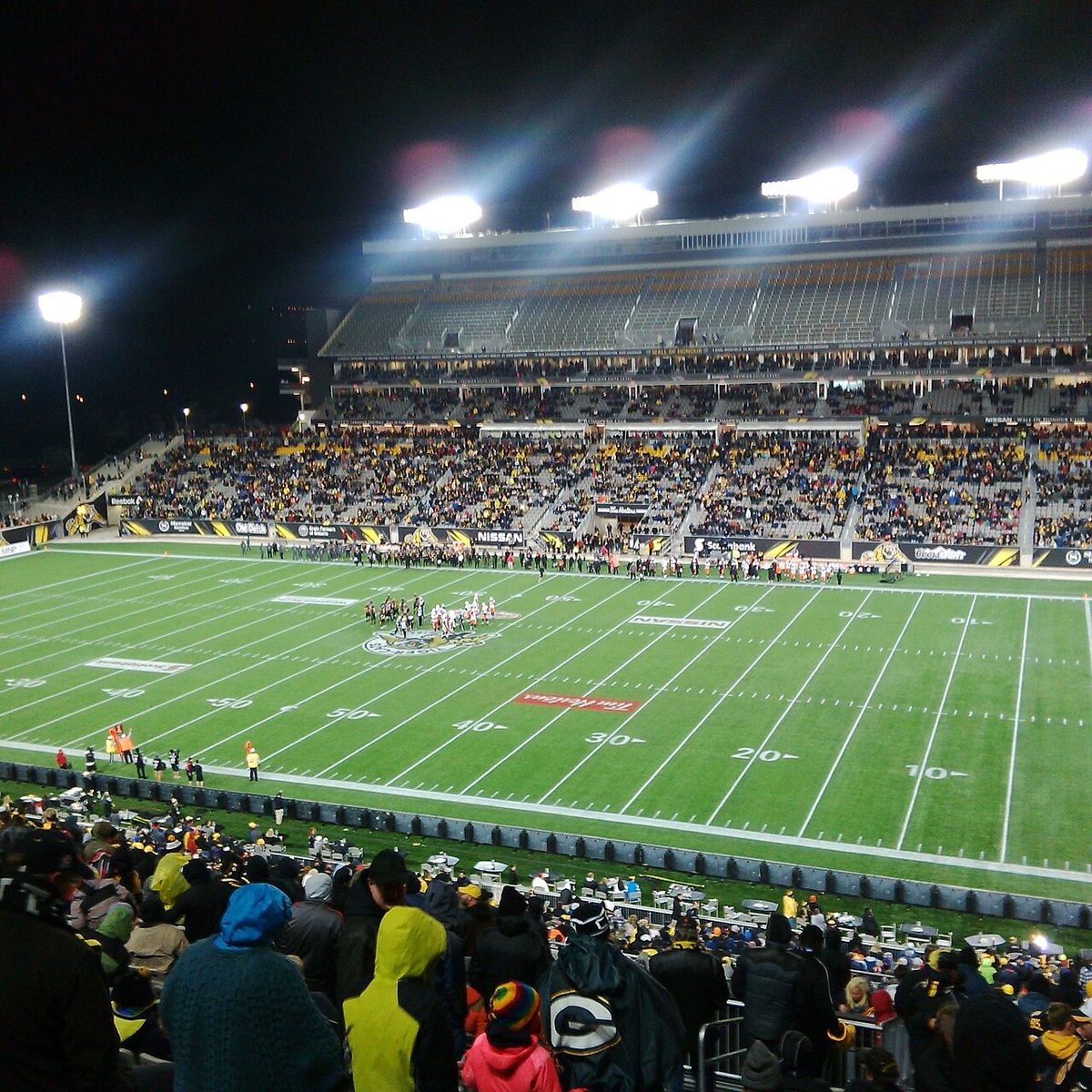 The BC Lions play the Hamilton Tiger-Cats in the fourth ever game at Tim Hortons Field. The upper stands on one side of the stadium were not