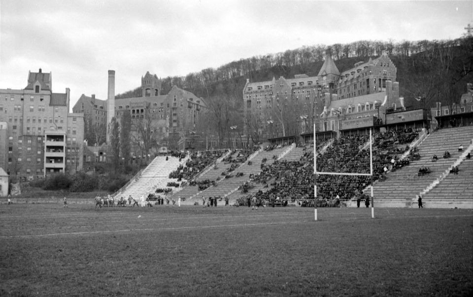 Overview of spectators occupying the stands Percival Molson Stadium of McGill University in Montreal during a football match between the tea