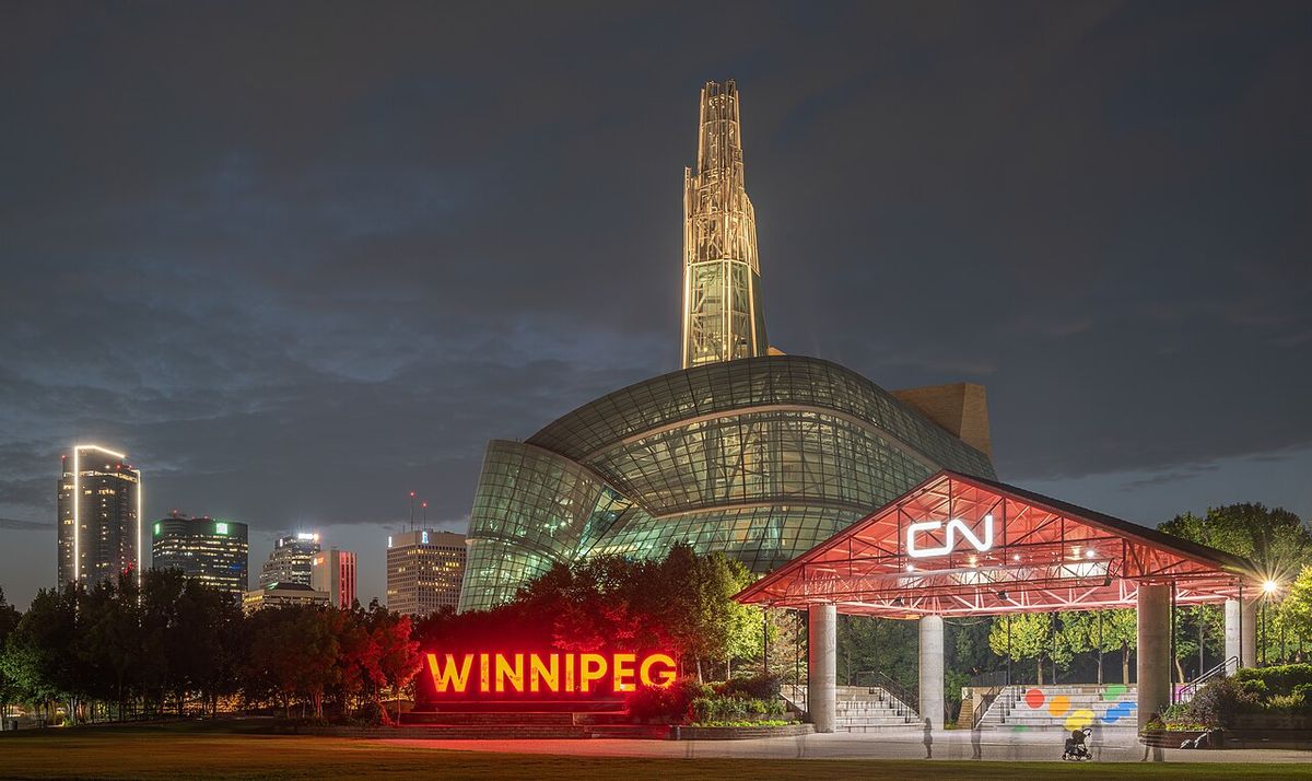 The Canadian Museum for Human Rights at night, viewed from The Forks in Winnipeg, Manitoba, Canada, with its illuminated glass atrium and sp